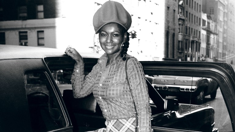 Sylvia Robinson poses next to a car in the 70s